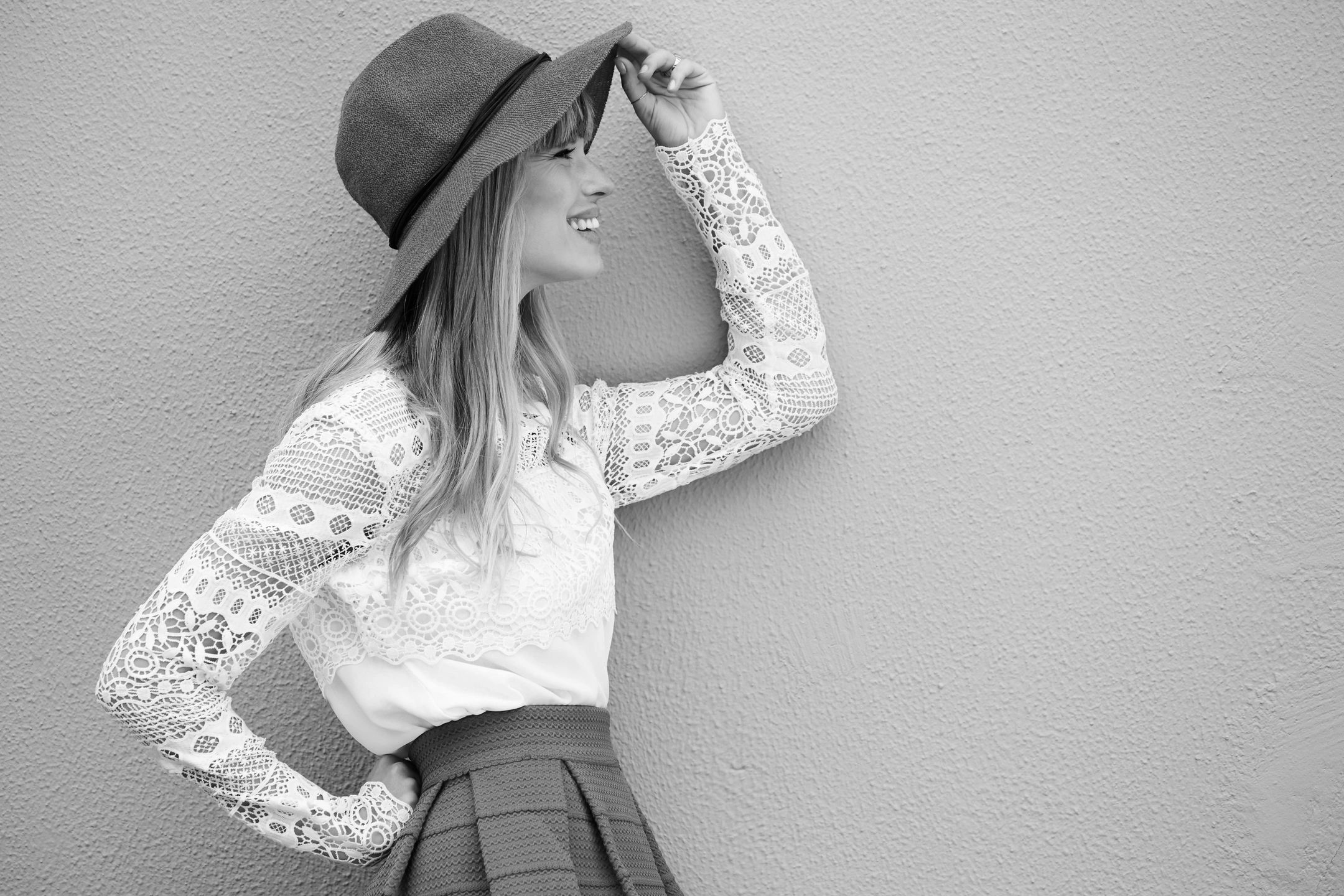 Salon in merced ca. Women with blonde hair. Wearing a trendy hat. 