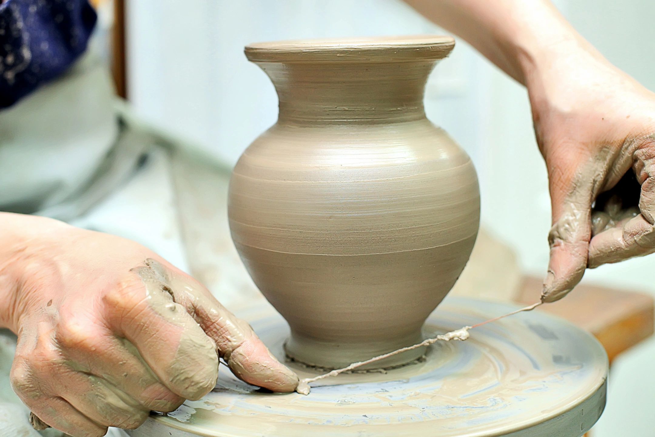 Piece On Clay On Potter Wheel by Stocksy Contributor Ezequiel