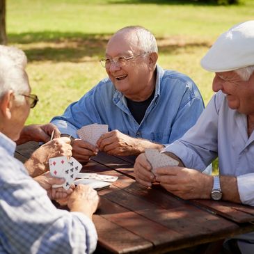 elderly men playing cards