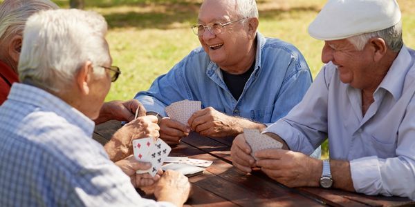 Caregiver serving tea to a resident.