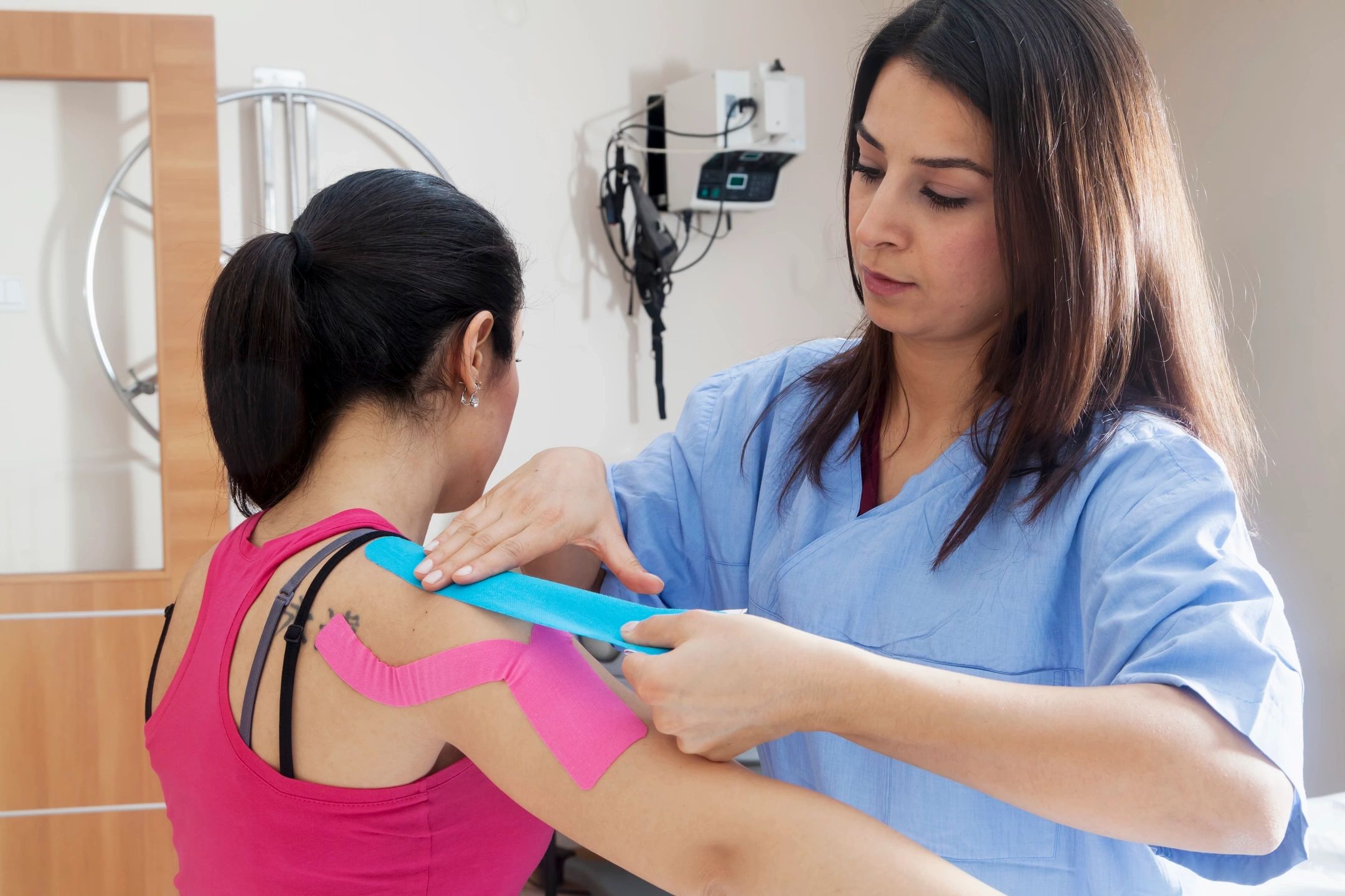 Kinesio taping during  physical therapy treatment session.