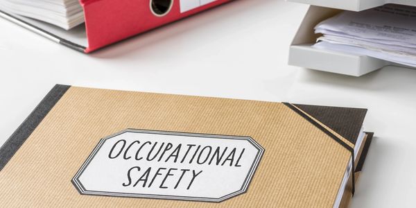 A diary on a desk with Occupational Safety on the label.