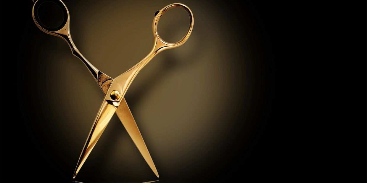 Gold shears on Black background