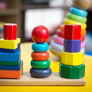 Colorful wooden stacker in a preschool classroom