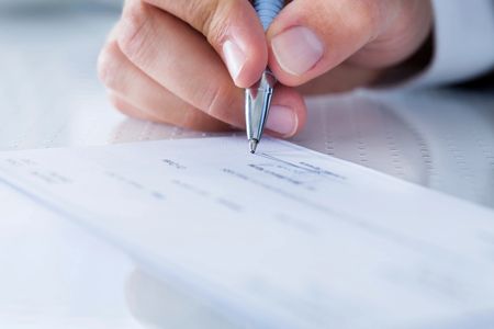 A man signing a document