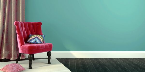 antique red chair on teal wall
