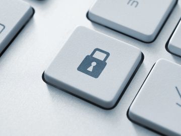 Keyboard key with a lock symbol representing security.