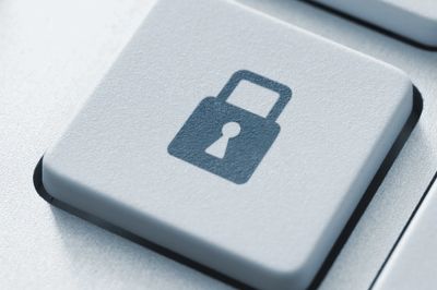 Close-up of a keyboard key with a lock symbol representing security.