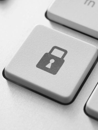 Keyboard key with a lock symbol representing security.