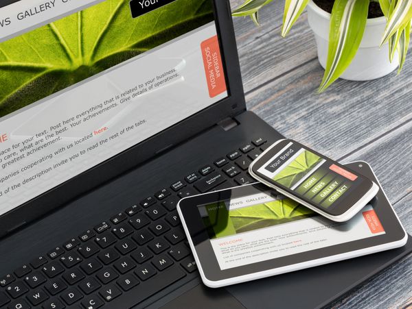 Responsive website displayed on laptop, tablet, and smartphone with green leaf theme.