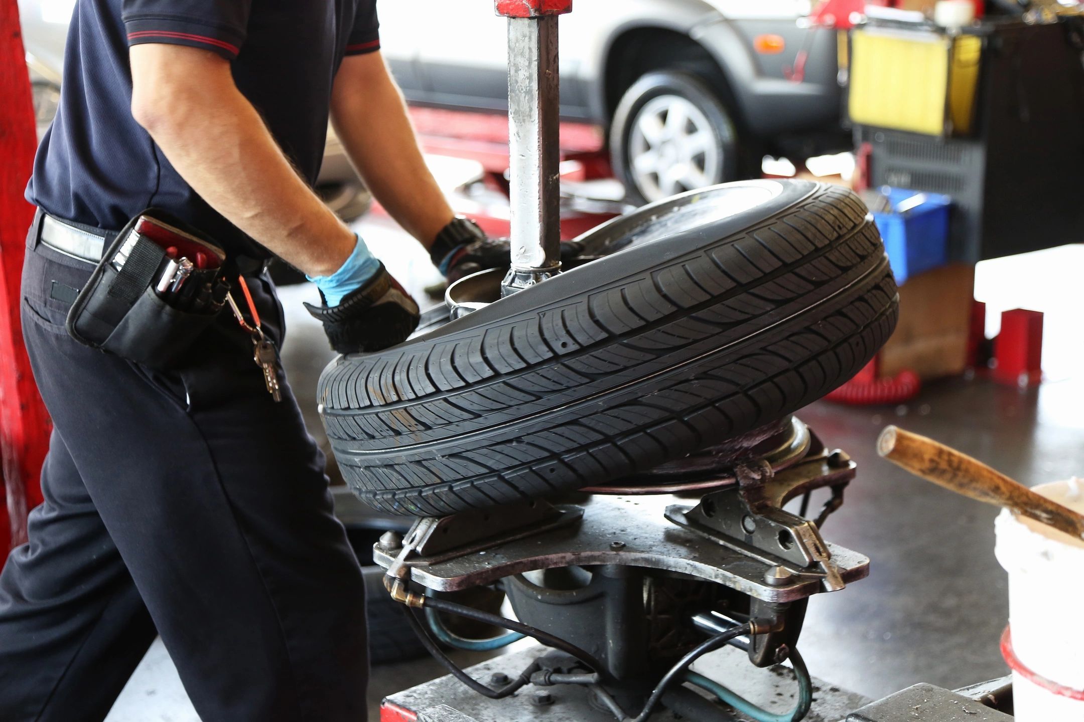 man fitting a tyre