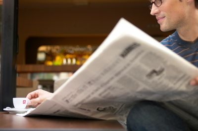 man reading a newspaper