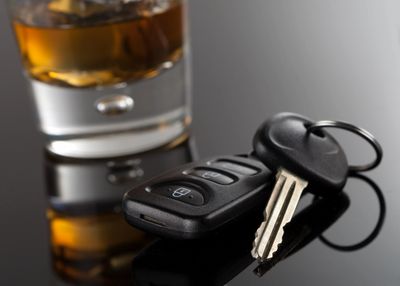 Keys and an alcoholic beverage following a third DUI arrest in Ft Lauderdale
