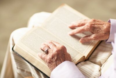 A woman reading the Bible, seeking directions and counsel.