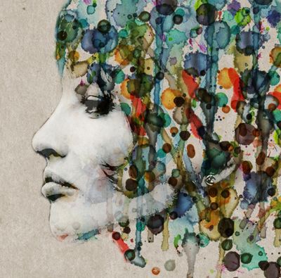 Artistic profile of a woman's face blending with colorful abstract paint splashes.