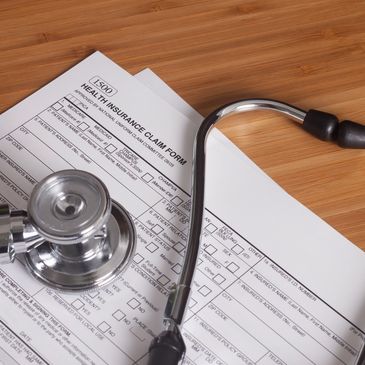 Stock image of a health insurance form with a link to the AXA health insurance homepage. 