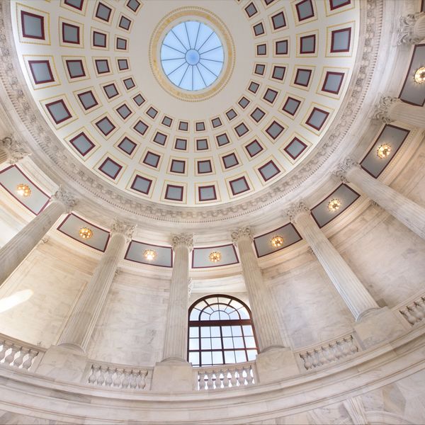 Interior view of a grand dome with columns and decorative ceiling.