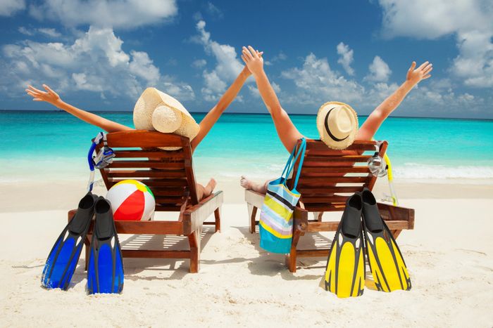 Couple with family on  beach in Hawaii or Caribbean or Mexico