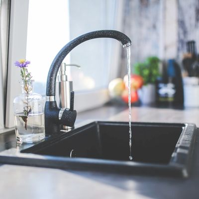 Faucet with running tap water. 