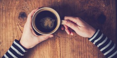 Person holding  a mug