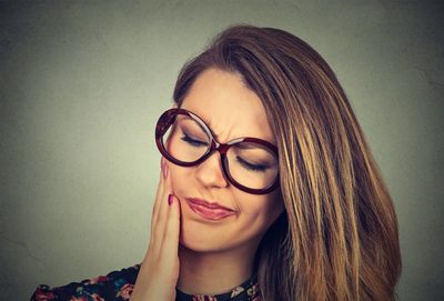 Photo of woman with tooth pain