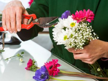 a florist cutting flowers