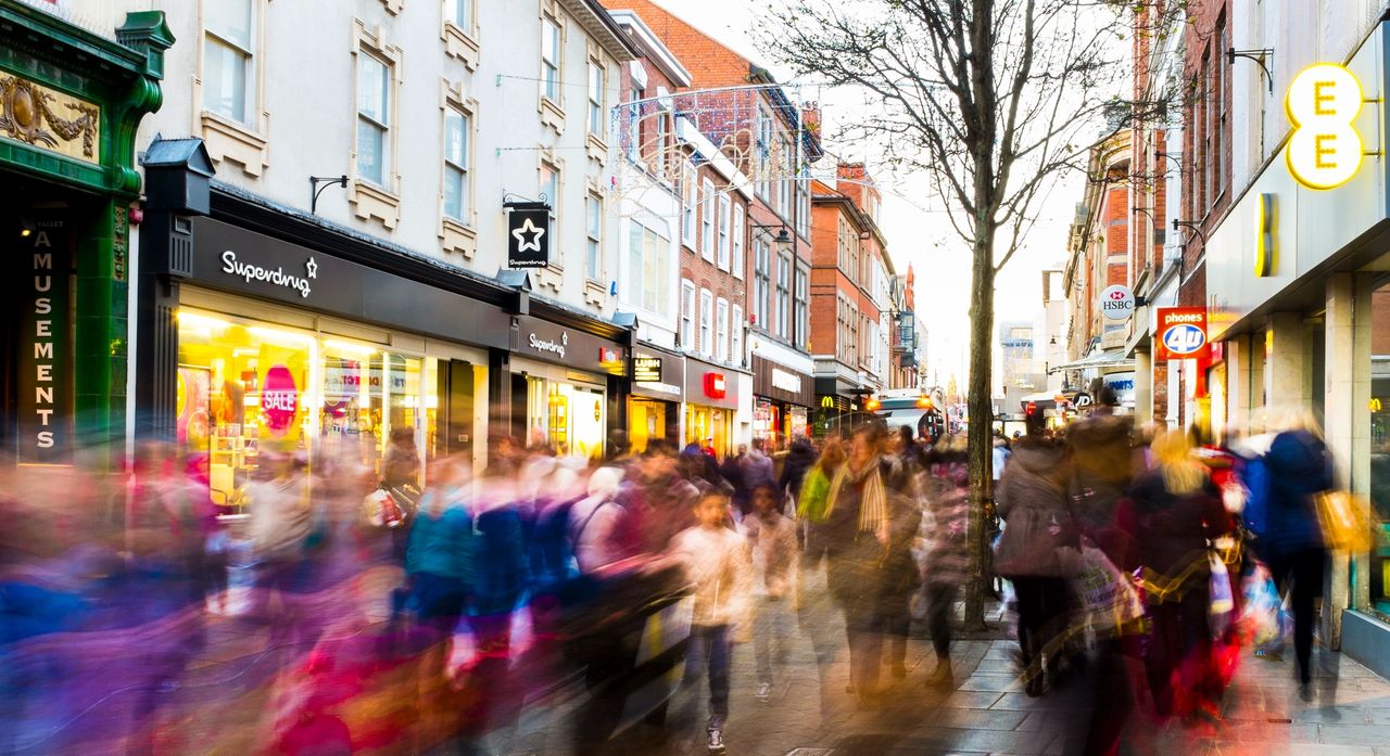 A busy time, as walking commuters travel to their destinations, in a downtown setting.