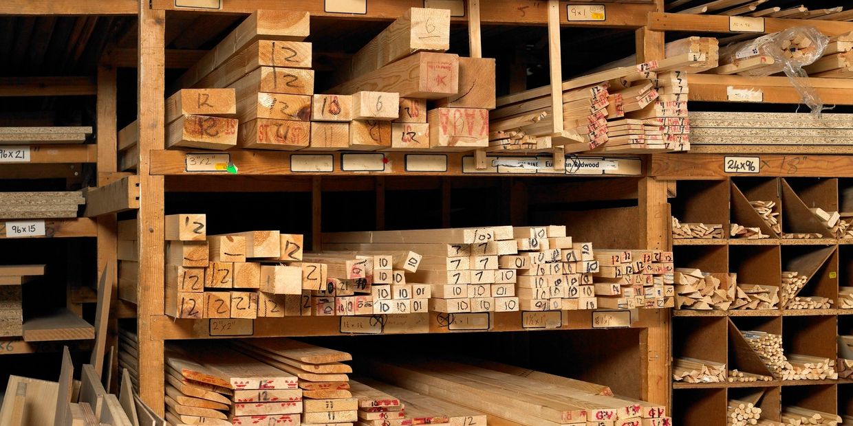 Carefully selected and arranged lumber, ready for expert craftsmanship in fence building. Organized