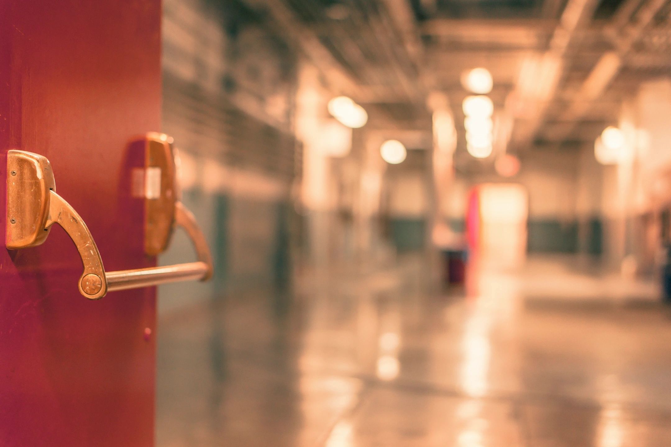 A door opening into a new school facility to signify future Permission to Succeed locations.