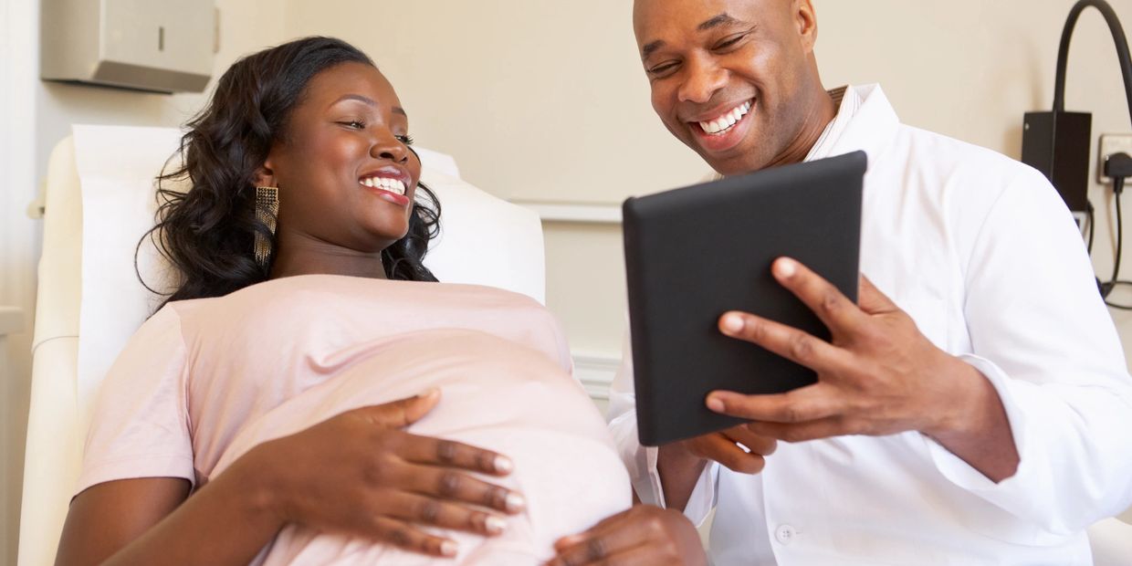 Pregnant couple viewing the prenatal ultrasound 