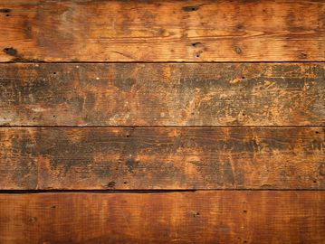 Close-up of rustic wooden planks with varied brown tones.