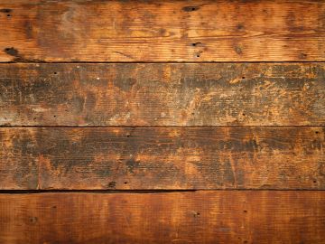 Close-up of rustic wooden planks with varied brown tones.