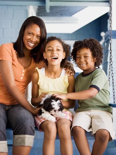 family sitting together with pet guinea pig