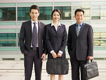 three business people standing 