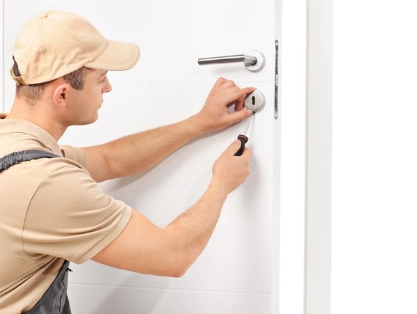 handyman repairing a door