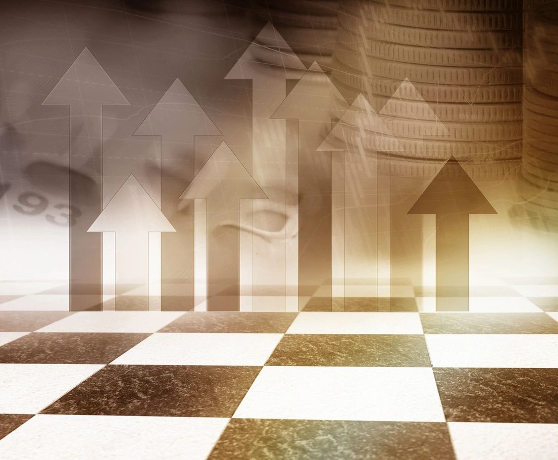 Chessboard with upward arrows symbolizing growth and strategy.