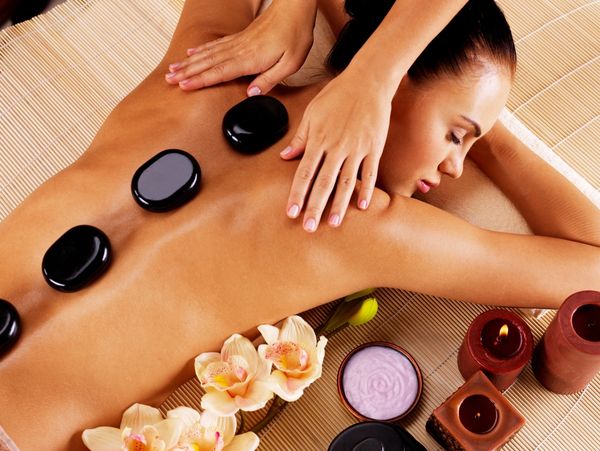 Massage therapist doing body work, deep tissue, hot stone, bamboo, Swedish massage, cupping , oil 