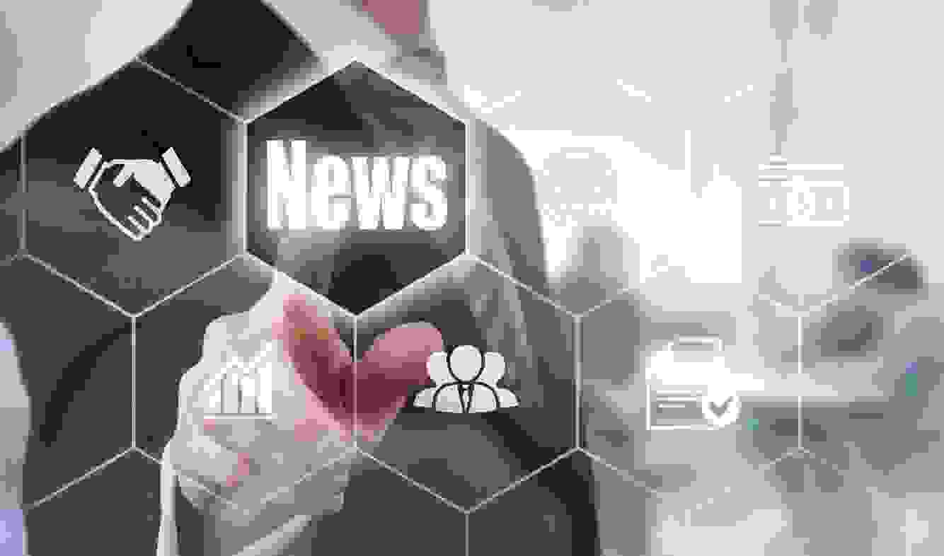 A businessman pointing to a display.