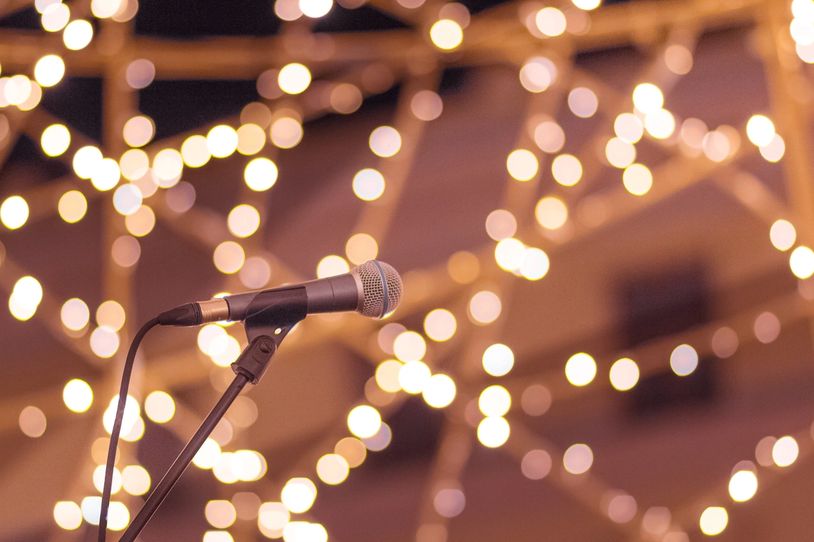 Microphone with blurred lights background.