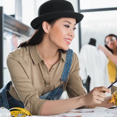 An Asian female smiling at her job