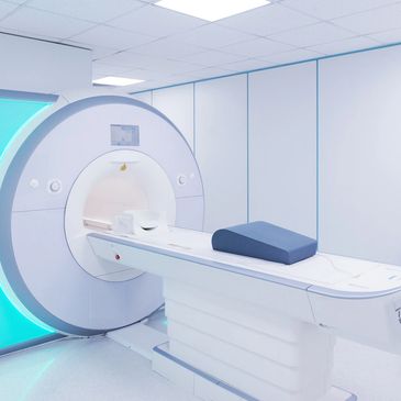 Modern MRI machine in a medical room.