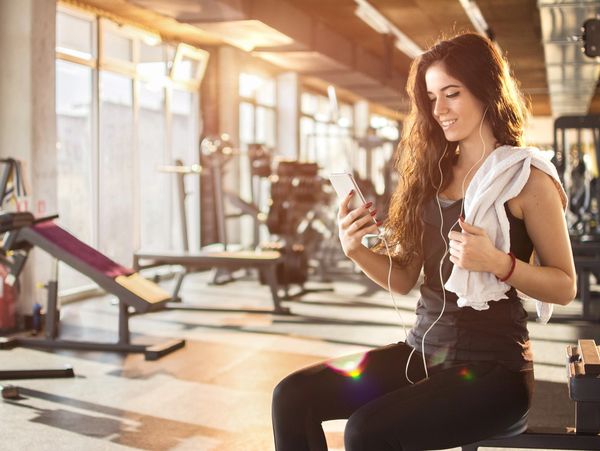 personal trainer fitness on the phone with a young professional