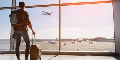 Traveler waiting on his flight at the airport