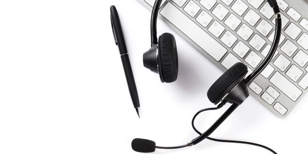 Image of a headphone with microphone and remote for IT services