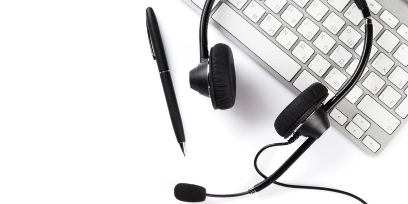 keyboard, headset and pen for online life coaching