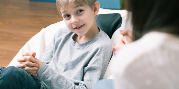 Boy talking to therapist