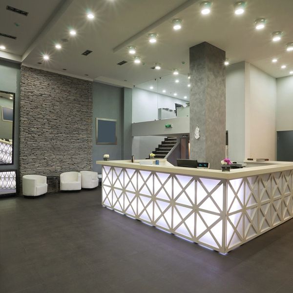 Gray and white lobby with concierge desk