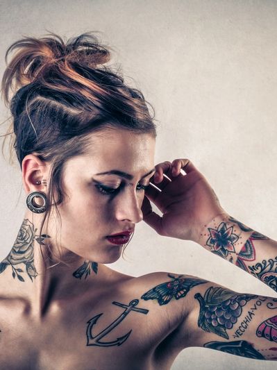 Woman posing with tattoo for studio located in Guelph Ontario