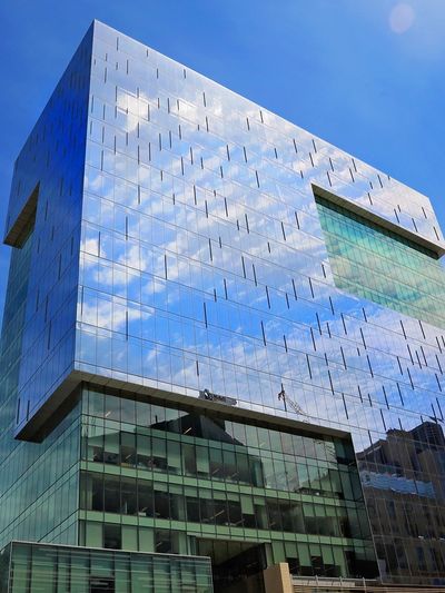 Bottom view of building with blue sky