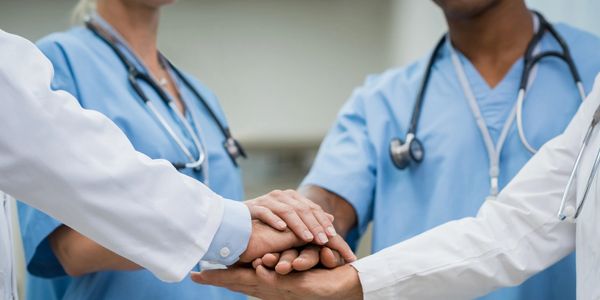 Group of Doctors with hands on top of each other